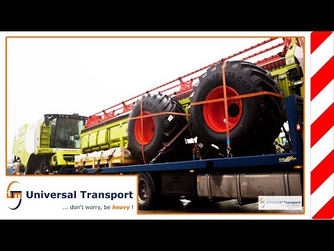 Universal Transport - Unloading Claas combine harvester with trailer
